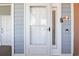 Charming entry door with stylish hardware and a doorbell, complemented by the unit number at 4609 Lightkeepers Way # 11J, Little River, SC 29566