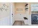 Well-organized mudroom with a bench, coat hooks, and access to laundry area for convenience at 4609 Lightkeepers Way # 11J, Little River, SC 29566