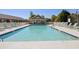Large community pool for residents to enjoy with plenty of seating and a pool house at 4609 Lightkeepers Way # 11J, Little River, SC 29566