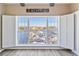 Expansive window provides panoramic marina views with white plantation shutters at 4609 Lightkeepers Way # 11J, Little River, SC 29566