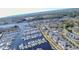 Aerial view of the community and marina with ocean in the background at 4625 Lightkeepers Way # L, Little River, SC 29566