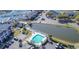 Aerial view of community pool, pond and surrounding buildings at 4625 Lightkeepers Way # L, Little River, SC 29566