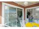 Balcony with glass sliders and marina view, showing glimpses of the interior at 4625 Lightkeepers Way # L, Little River, SC 29566