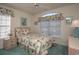 Charming bedroom with floral bedding and window seat at 4625 Lightkeepers Way # L, Little River, SC 29566