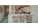 Kitchen with breakfast bar and view into the dining area at 4625 Lightkeepers Way # L, Little River, SC 29566