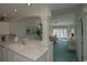 Kitchen with breakfast bar and view into living room at 4625 Lightkeepers Way # L, Little River, SC 29566