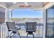 Enjoy water views from this balcony, complete with two chairs and a small table at 4629 Lightkeepers Way # 6-I, Little River, SC 29566