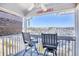 Enjoy water views from this balcony, complete with two chairs and a small table at 4629 Lightkeepers Way # 6-I, Little River, SC 29566