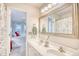 Double vanity bathroom with a view of the bedroom at 4629 Lightkeepers Way # 6-I, Little River, SC 29566