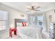 King bedroom with water views and ceiling fan at 4629 Lightkeepers Way # 6-I, Little River, SC 29566