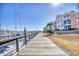 Walk along the boardwalk and enjoy views of the marina and nearby buildings at 4629 Lightkeepers Way # 6-I, Little River, SC 29566