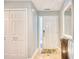 Bright entryway with tile flooring, white doors and mirror at 4629 Lightkeepers Way # 6-I, Little River, SC 29566