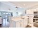 Kitchen features white cabinets, stainless steel appliances, and a peninsula at 4629 Lightkeepers Way # 6-I, Little River, SC 29566