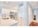 White kitchen cabinets, stainless steel appliances, and a peninsula at 4629 Lightkeepers Way # 6-I, Little River, SC 29566