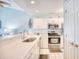 Modern kitchen with stainless steel appliances and white cabinets at 4629 Lightkeepers Way # 6-I, Little River, SC 29566