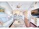 Living room with hardwood floors, vaulted ceilings, and kitchen view at 4629 Lightkeepers Way # 6-I, Little River, SC 29566
