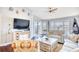 Living room with hardwood floors, vaulted ceilings, and water views at 4629 Lightkeepers Way # 6-I, Little River, SC 29566