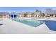 Community pool with lounge chairs and adjacent building at 4629 Lightkeepers Way # 6-I, Little River, SC 29566