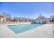 Community pool with lounge chairs and adjacent building at 4629 Lightkeepers Way # 6-I, Little River, SC 29566
