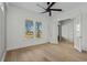 Bright bedroom with modern ceiling fan, light wood floors and exterior access at 477 Starlit Way, Myrtle Beach, SC 29579