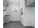 Modern laundry room with hexagon tile floor and built in cabinets at 477 Starlit Way, Myrtle Beach, SC 29579