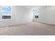 Bright bedroom with neutral carpet and large windows at 49 Cape Point Dr., Conway, SC 29527