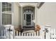 Inviting front entrance with a white picket fence and stone walkway at 5719 Coquina Po Coquina Point Dr., North Myrtle Beach, SC 29582