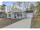 Newly built home with light blue siding, gray driveway and landscaping at 508 Truitt Dr., Longs, SC 29568