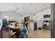 Open kitchen with island, stainless steel appliances, and wood flooring at 508 Truitt Dr., Longs, SC 29568