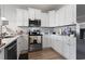 Modern kitchen with white cabinets and stainless steel appliances at 508 Truitt Dr., Longs, SC 29568