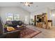 Bright living room featuring hardwood floors, comfy seating, and a built-in entertainment center at 508 Truitt Dr., Longs, SC 29568