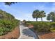 Elevated boardwalk pathway through lush landscaping toward the beach at 5308 N Ocean Blvd. # 1406, Myrtle Beach, SC 29577