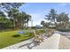 Comfortable loungers and rocking chairs on grassy area near beach at 5308 N Ocean Blvd. # 1406, Myrtle Beach, SC 29577