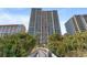 Tall beachfront building with walkway in front at 5308 N Ocean Blvd. # 1406, Myrtle Beach, SC 29577