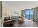 Living room with ocean view and sofa at 5308 N Ocean Blvd. # 1406, Myrtle Beach, SC 29577