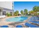 Resort-style pool with multiple lounge chairs at 5308 N Ocean Blvd. # 1406, Myrtle Beach, SC 29577