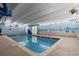 Inviting indoor pool with beach mural and ample space for relaxation at 5308 N Ocean Blvd. # 1406, Myrtle Beach, SC 29577