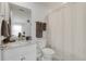 Bathroom with a granite countertop vanity, toilet, and shower with a curtain at 5314 Abbey Park Loop, Myrtle Beach, SC 29579