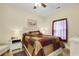 Comfortable bedroom with a patchwork quilt and wooden floors at 5314 Abbey Park Loop, Myrtle Beach, SC 29579