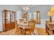 Dining room filled with natural light featuring hardwood floors and traditional wooden furniture at 5314 Abbey Park Loop, Myrtle Beach, SC 29579
