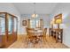 Dining room filled with natural light featuring hardwood floors and traditional wooden furniture at 5314 Abbey Park Loop, Myrtle Beach, SC 29579