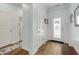Welcoming entryway with hardwood floors, beadboard wainscoting, and ample natural light at 5314 Abbey Park Loop, Myrtle Beach, SC 29579