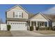 Charming two-story home with neutral siding, a two-car garage, and a welcoming front porch at 5314 Abbey Park Loop, Myrtle Beach, SC 29579
