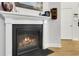 Close-up of the fireplace featuring a white mantle and contrasting black trim at 5314 Abbey Park Loop, Myrtle Beach, SC 29579