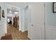 Bright hallway with hardwood floors and wainscoting leading to other rooms at 5314 Abbey Park Loop, Myrtle Beach, SC 29579