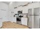 Well-equipped kitchen featuring stainless steel appliances and ample white cabinetry at 5314 Abbey Park Loop, Myrtle Beach, SC 29579