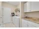 Laundry room with washer, dryer, and extra storage at 5314 Abbey Park Loop, Myrtle Beach, SC 29579