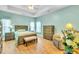 Bright main bedroom featuring a ceiling fan, natural light, and wooden furniture set at 5314 Abbey Park Loop, Myrtle Beach, SC 29579