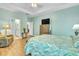 Bright main bedroom featuring a ceiling fan, natural light, and wooden furniture set at 5314 Abbey Park Loop, Myrtle Beach, SC 29579