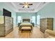 Bright main bedroom featuring a ceiling fan, natural light, and wooden furniture set at 5314 Abbey Park Loop, Myrtle Beach, SC 29579
